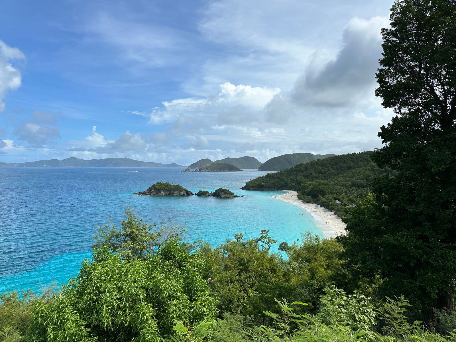 Trunk Bay seen from the hillside overlook, a white-sand beach and small rocky cay that top most lists of things to do in St. John, USVI